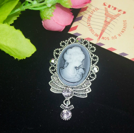 Vintage Gray Queen Head Brooch